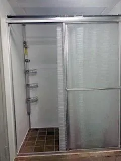 a white toilet sitting next to a bathroom sink