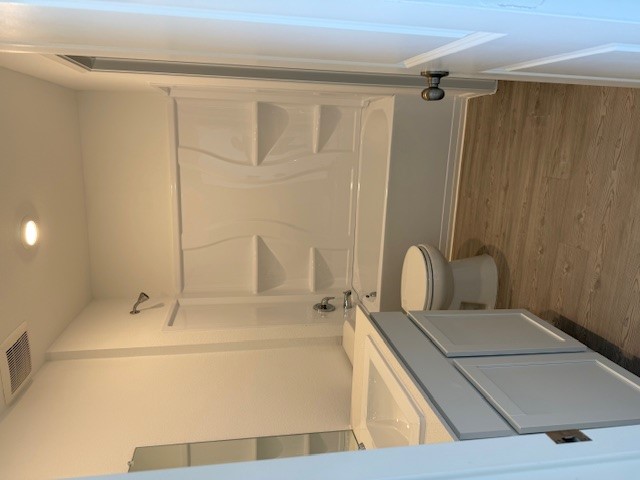 216 Sormonne Loop Kyle, TX 78640 - Photo 16 of 29 a bathroom with a granite countertop sink toilet and shower