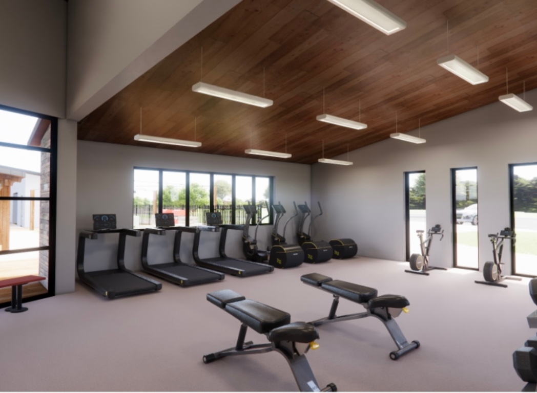 216 Sormonne Loop Kyle, TX 78640 - Photo 25 of 29 a living room with furniture a window and gym equipment