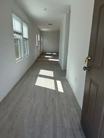 wooden floor in a hall with an entryway