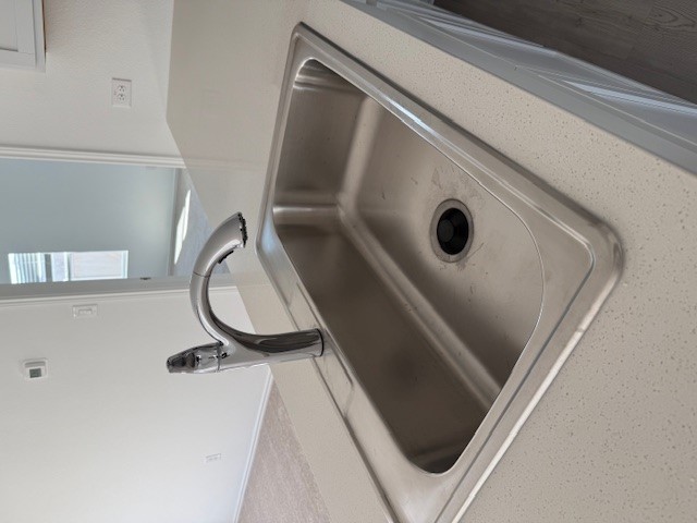 216 Sormonne Loop Kyle, TX 78640 - Photo 7 of 29 a close view of sink and tap