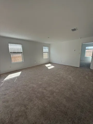 an empty room with a empty space and window