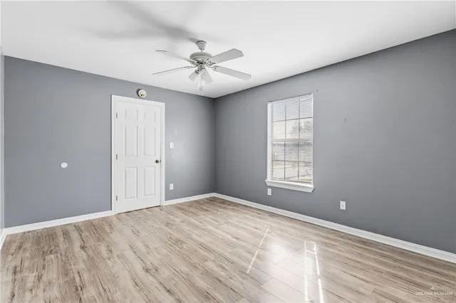 a view of an empty room with a window