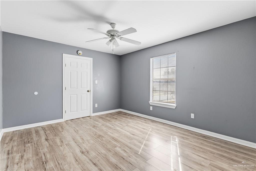 1918 Angus Street, Unit 2 Mission, TX 78572 - Photo 11 of 18 a view of an empty room with a window