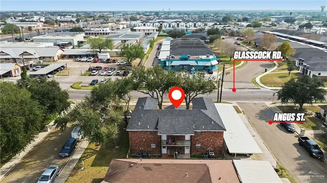an aerial view of residential houses with outdoor space