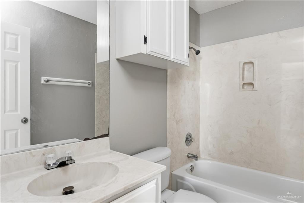1918 Angus Street, Unit 2 Mission, TX 78572 - Photo 4 of 18 a bathroom with a sink and a bathtub