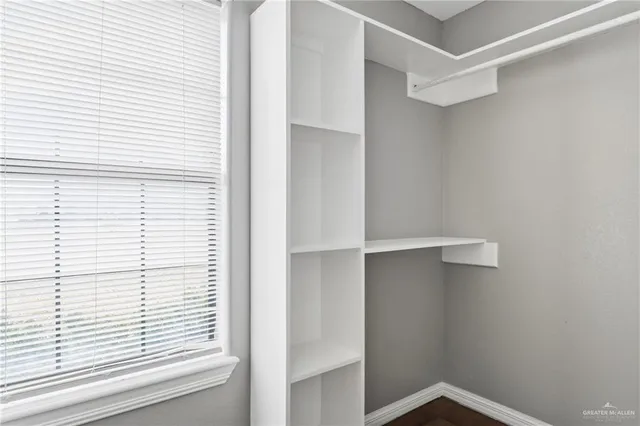 a view of an empty walk in closet