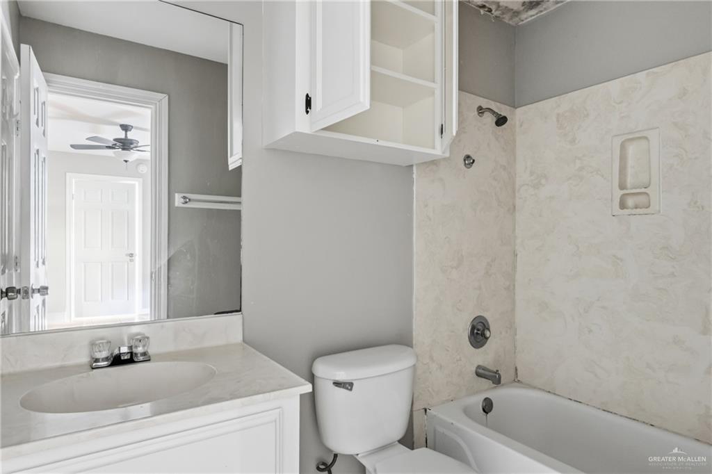 1918 Angus Street, Unit 2 Mission, TX 78572 - Photo 7 of 18 a bathroom with a sink a toilet and shower
