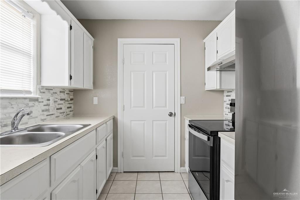 1918 Angus Street, Unit 2 Mission, TX 78572 - Photo 8 of 18 a kitchen with a sink and cabinets