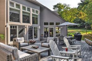 369 Maple Lane Canonsburg, PA 15317 - Photo 14 of 49 a view of a patio with couches table and chairs under an umbrella