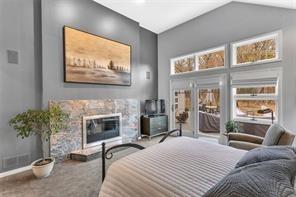 369 Maple Lane Canonsburg, PA 15317 - Photo 24 of 49 a bedroom with furniture a fireplace and a flat screen tv