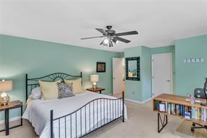 369 Maple Lane Canonsburg, PA 15317 - Photo 34 of 49 a bedroom with a bed and a chandelier