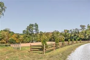 a view of a yard with swimming pool