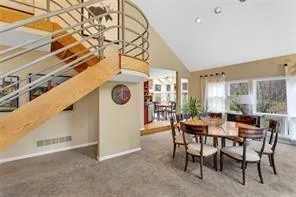 a dining room with furniture and window