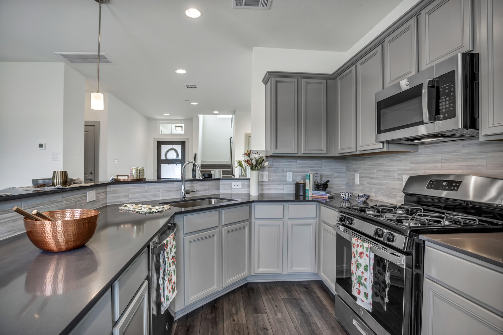 2121 Local Rebel Street Leander, TX 78641 - Photo 1 of 32 Upgraded kitchen with stainless steel appliances, gas stove, silestone countertops, 36"cabinets, and tasteful ceramic tile backsplash