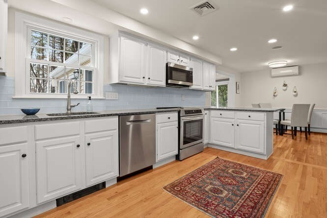 3 Summit Road Southborough, MA 01772 - Photo 7 of 41 a kitchen with granite countertop appliances cabinets and a sink
