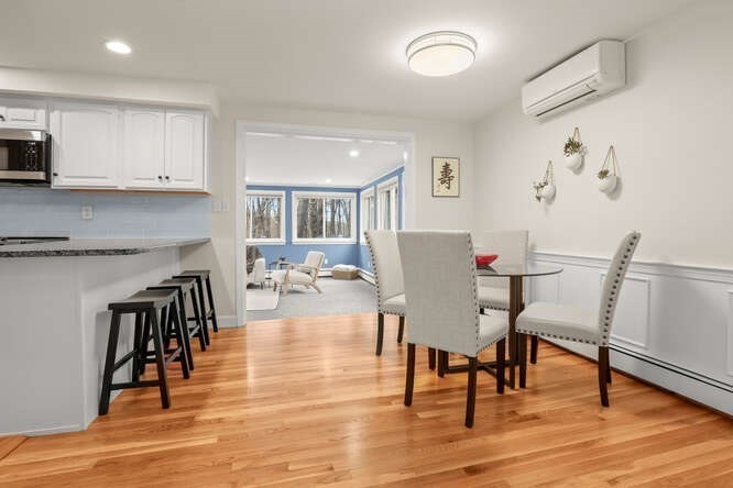 3 Summit Road Southborough, MA 01772 - Photo 9 of 41 a view of a dining room with furniture and wooden floor