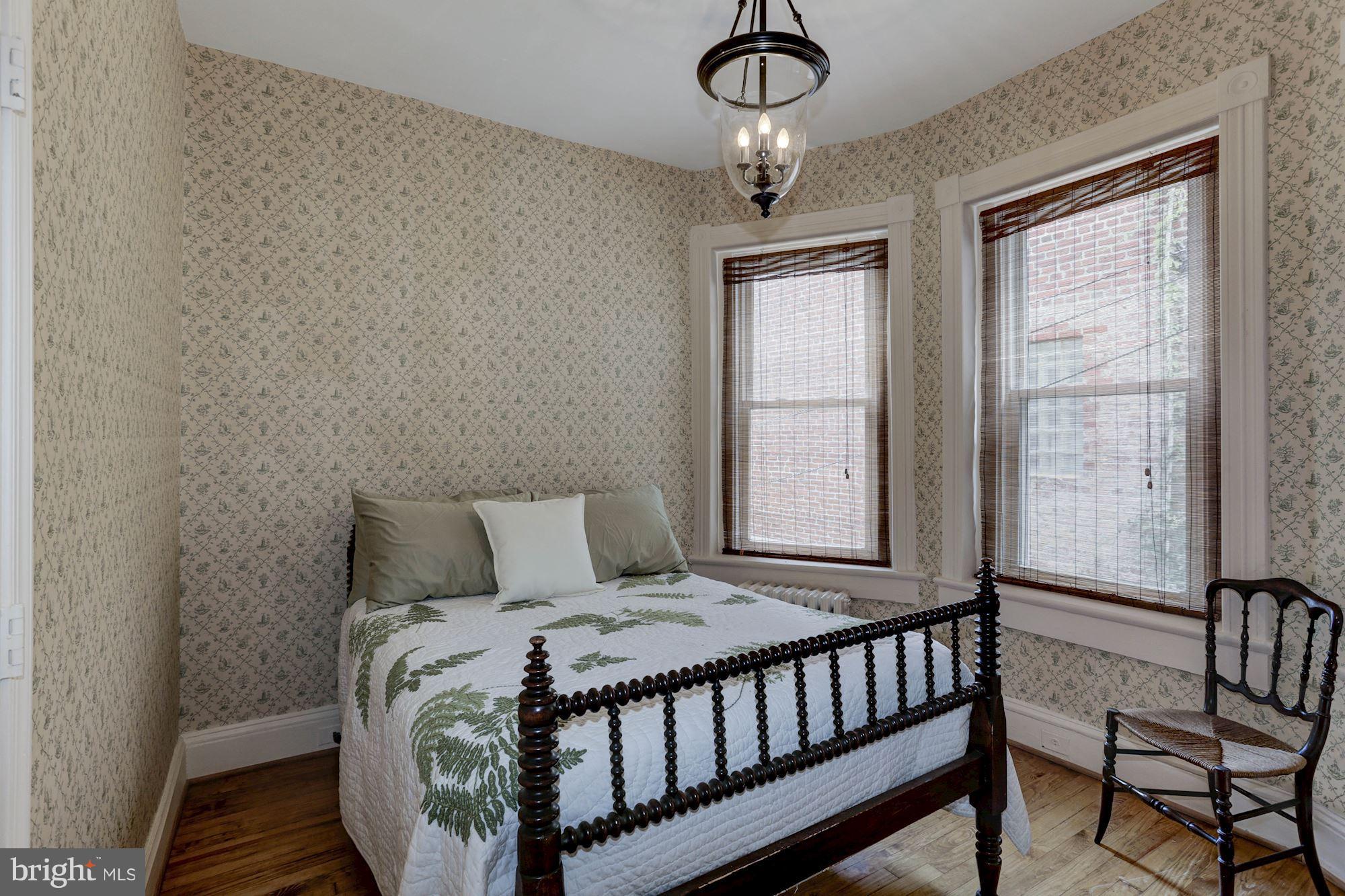 1615 21st Street Northwest Washington, DC 20009 - Photo 16 of 30 a bedroom with a bed and a window