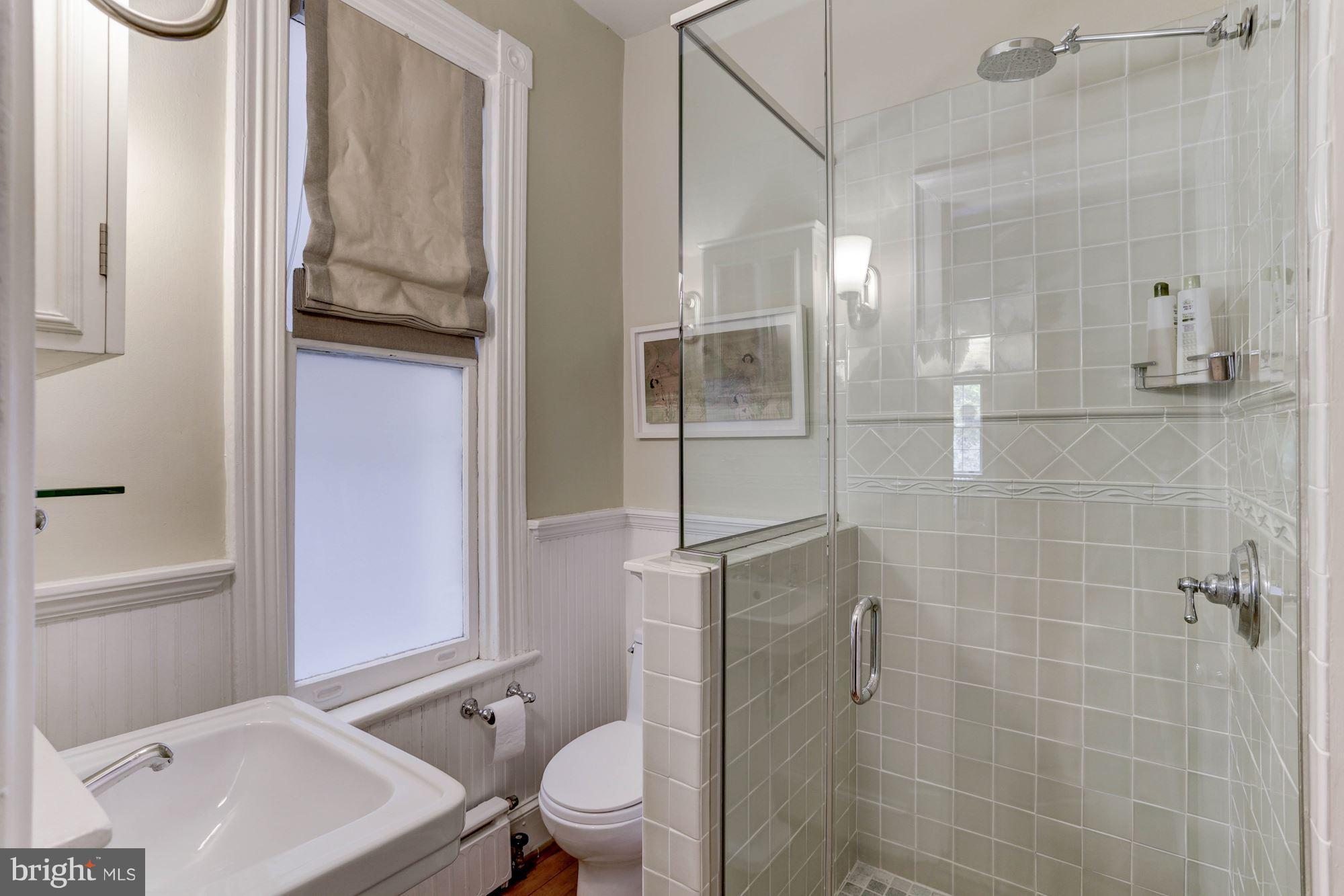 1615 21st Street Northwest Washington, DC 20009 - Photo 17 of 30 a bathroom with a toilet a sink and shower