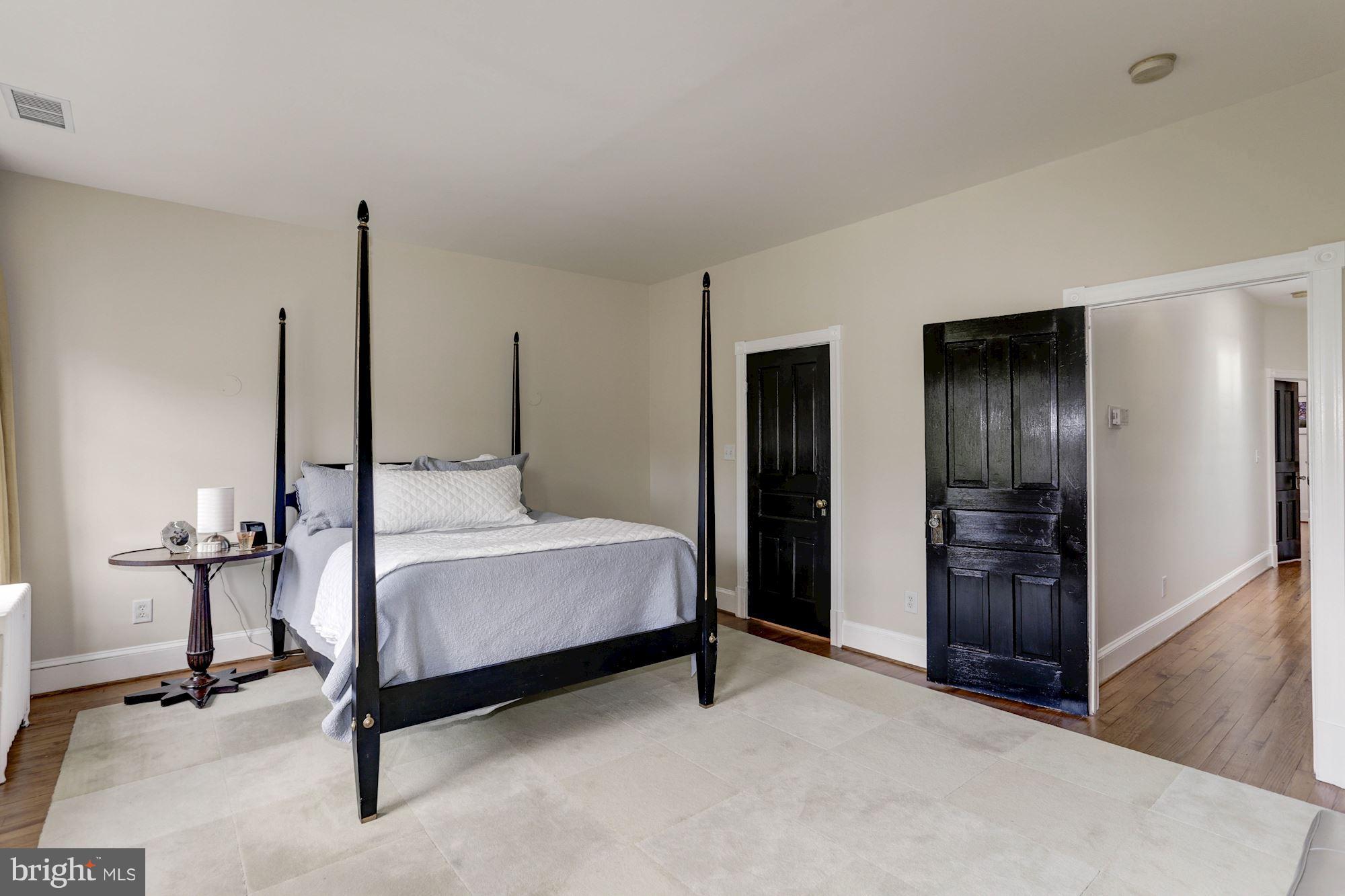 1615 21st Street Northwest Washington, DC 20009 - Photo 19 of 30 a bedroom with a bed and a table