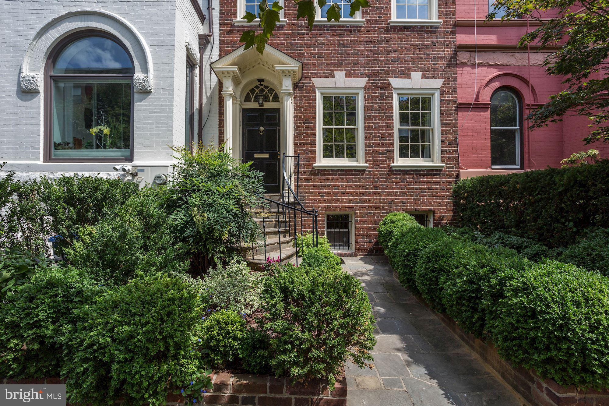 1615 21st Street Northwest Washington, DC 20009 - Photo 3 of 30 front view of a brick house with a large windows