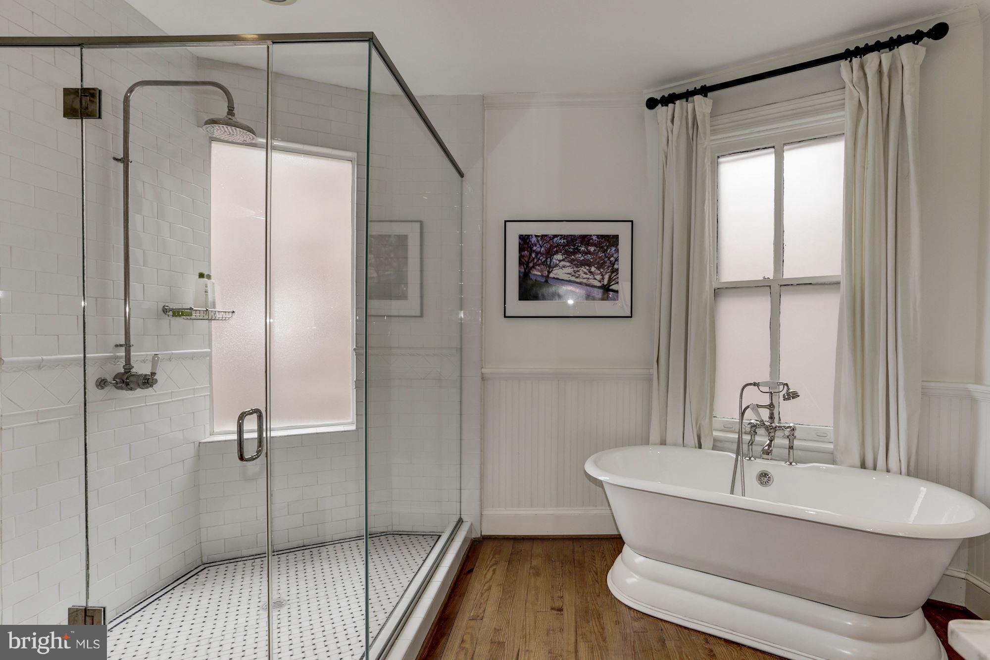 1615 21st Street Northwest Washington, DC 20009 - Photo 21 of 30 a bathroom with a shower a sink and a toilet