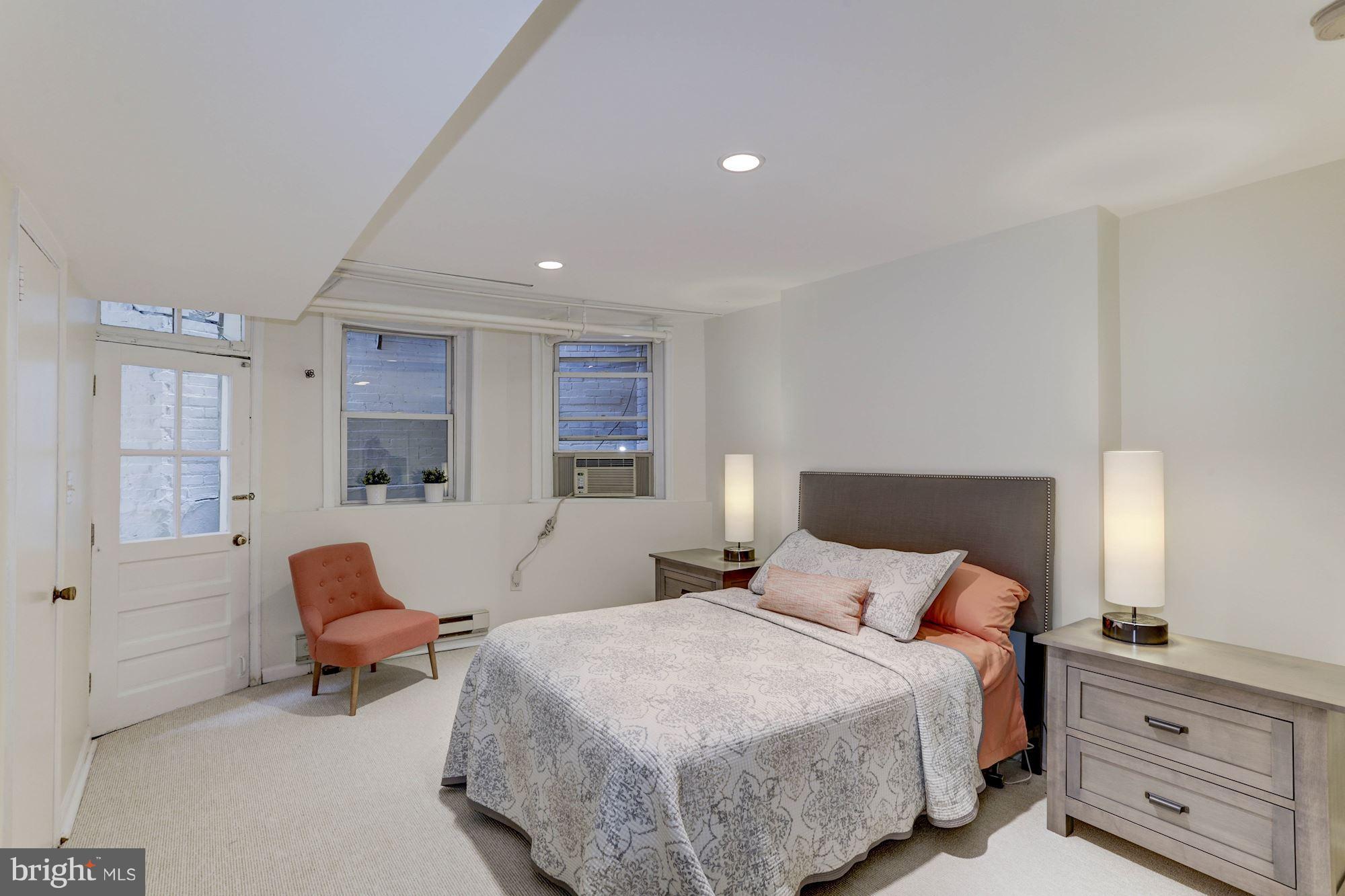 1615 21st Street Northwest Washington, DC 20009 - Photo 25 of 30 a bedroom with a bed and window