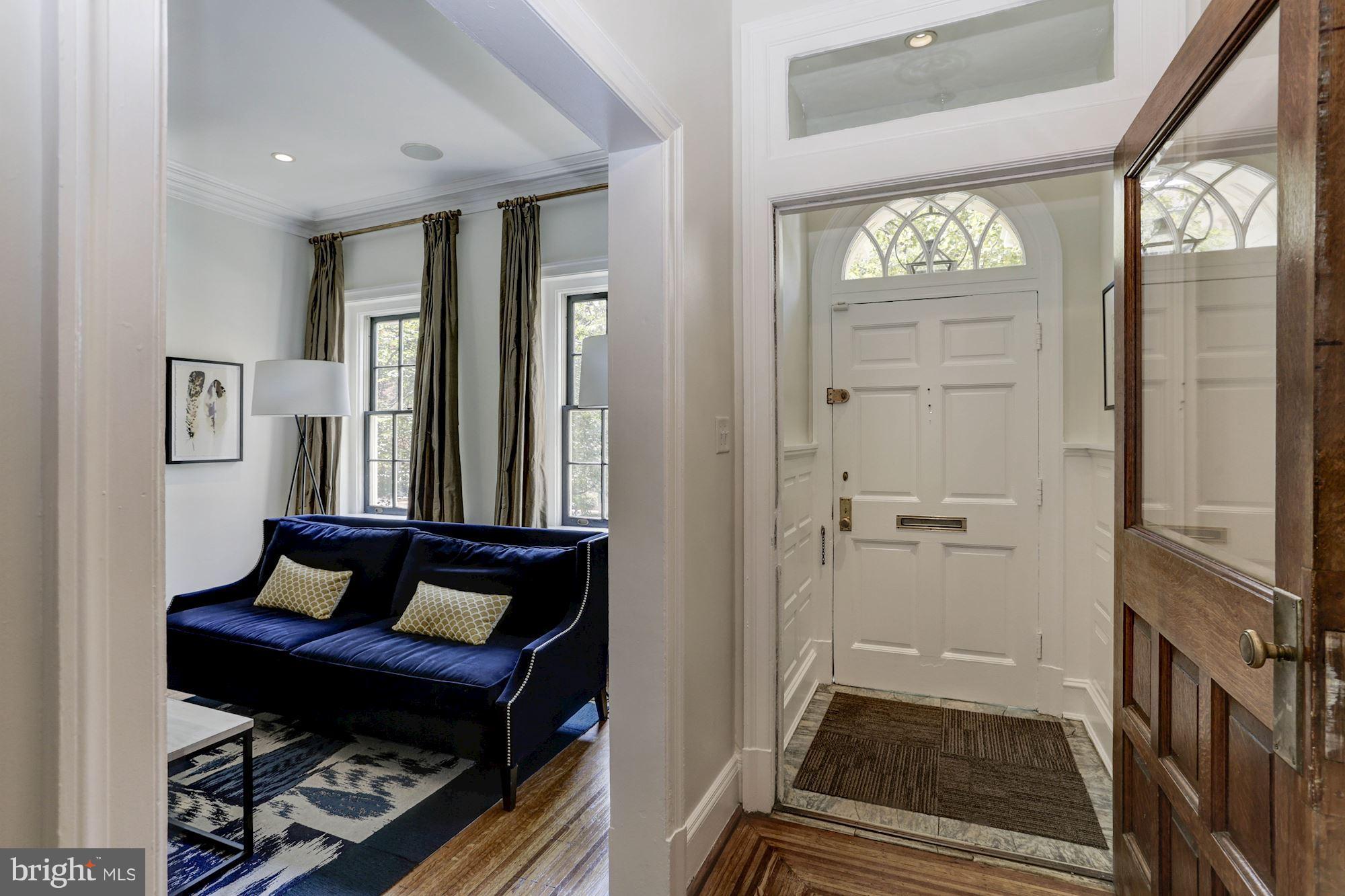 1615 21st Street Northwest Washington, DC 20009 - Photo 4 of 30 a room with furniture and a window
