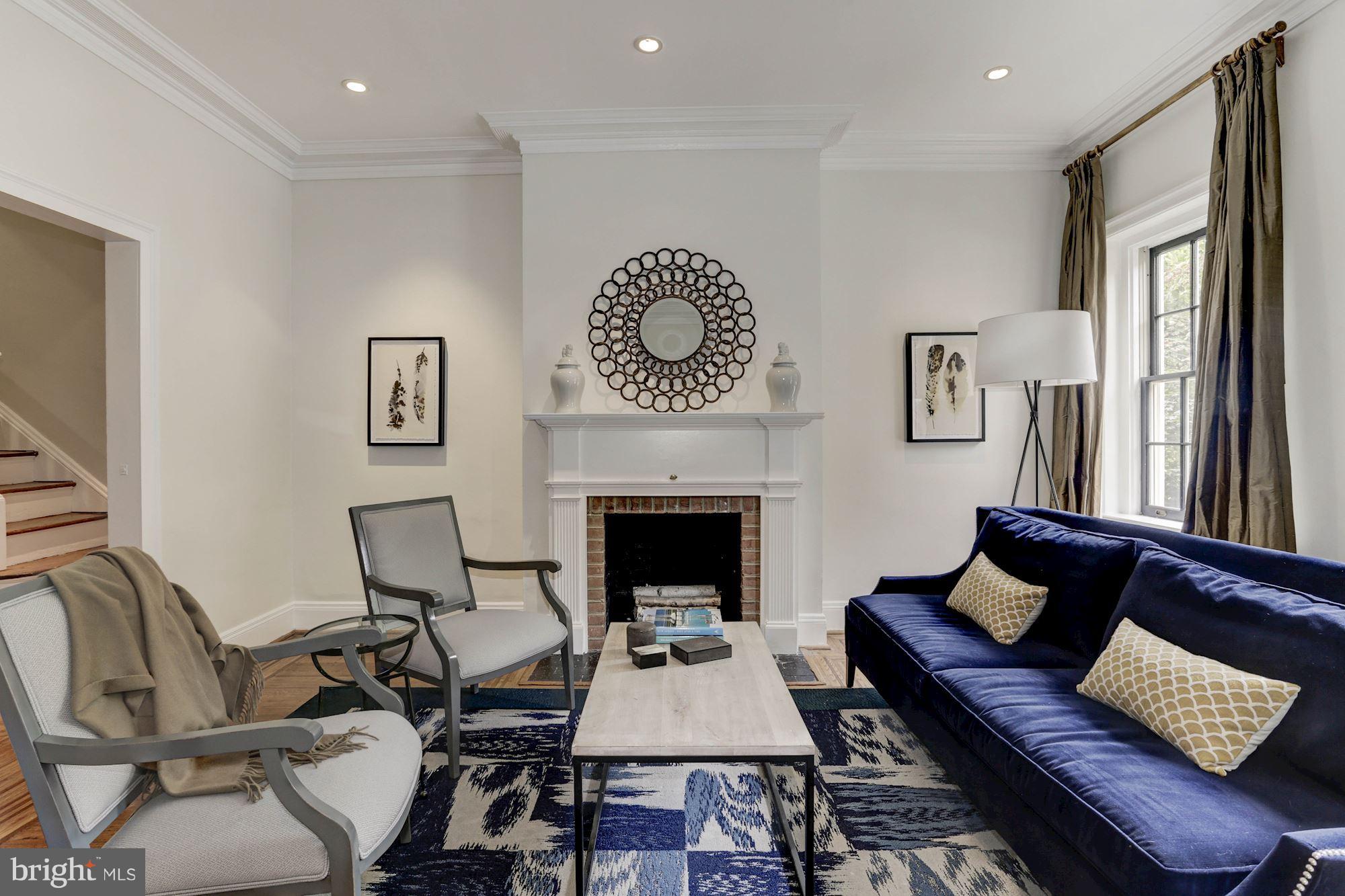 1615 21st Street Northwest Washington, DC 20009 - Photo 5 of 30 a living room with furniture and a fireplace