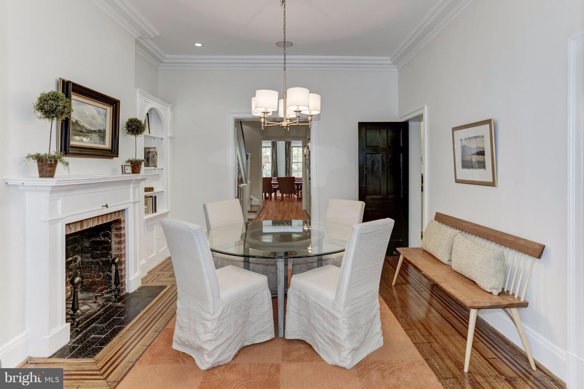 1615 21st Street Northwest Washington, DC 20009 - Photo 9 of 30 a view of a dining room with furniture a chandelier and wooden floor