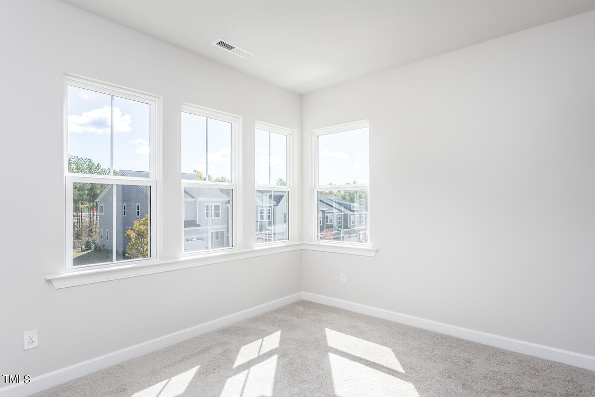 6110 Adecor Way Raleigh, NC 27617 - Photo 17 of 31 a view of an empty room with a window