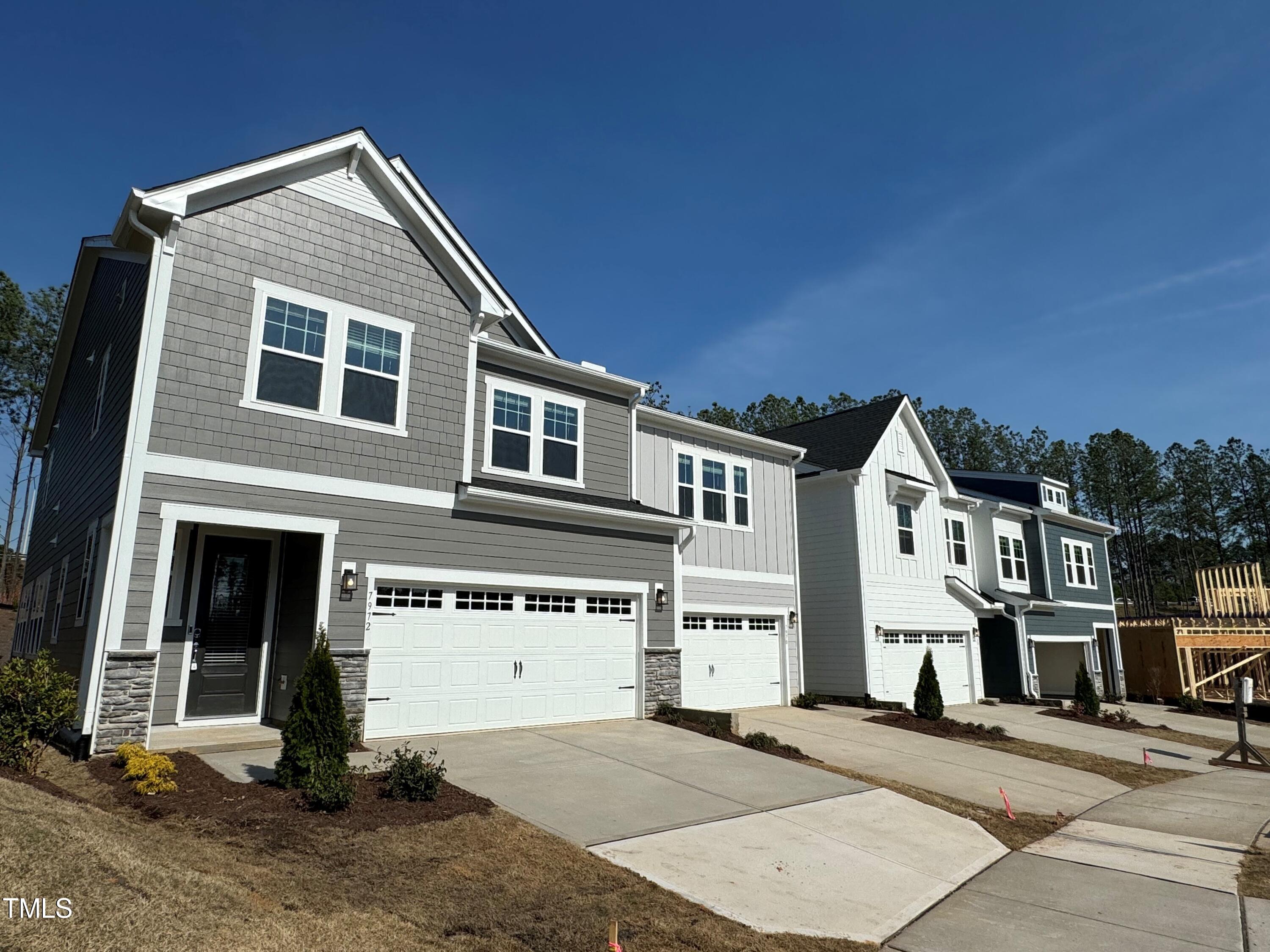6110 Adecor Way Raleigh, NC 27617 - Photo 26 of 31 a front view of a house with a yard