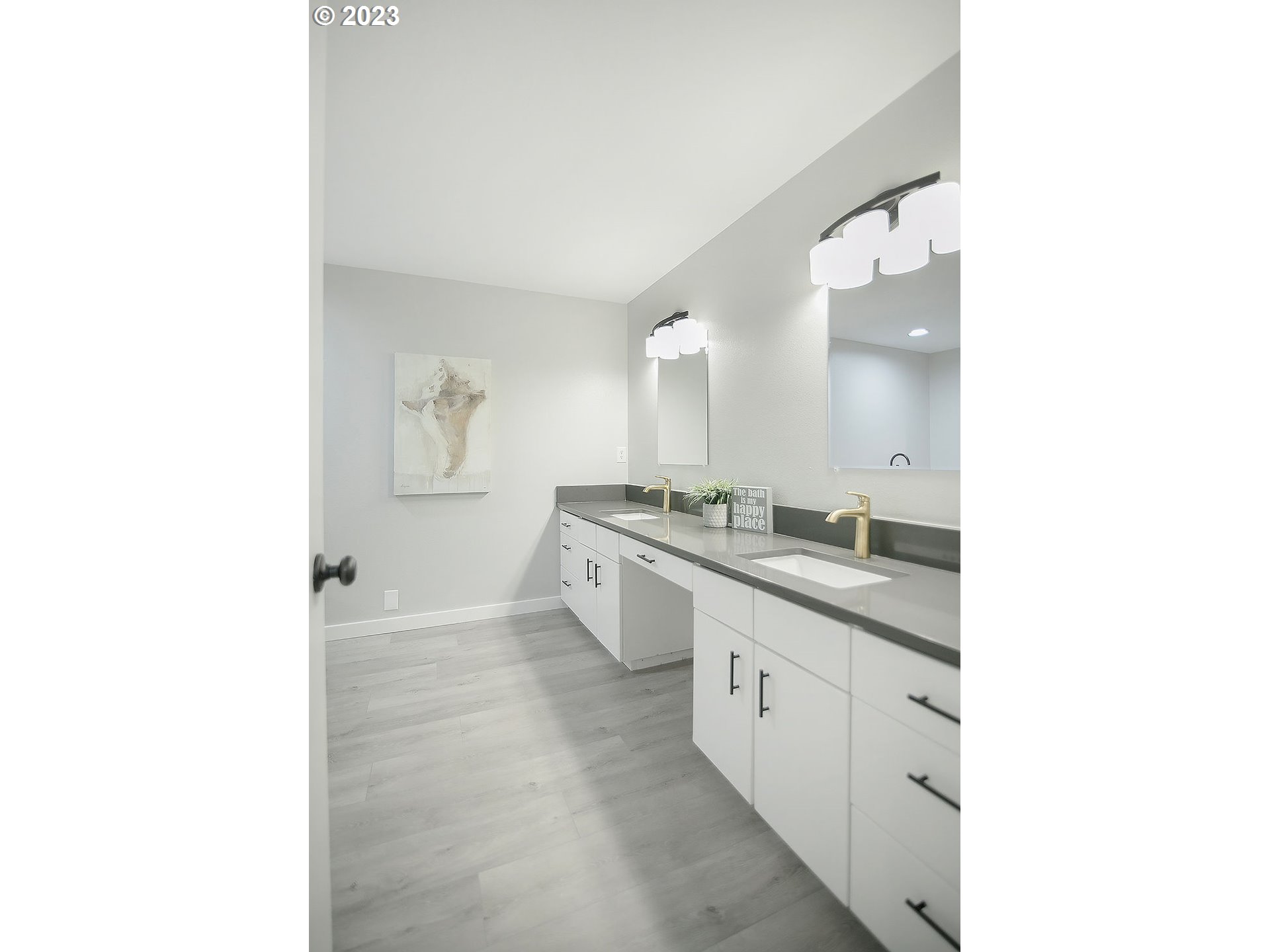 2811 Northeast 164th Street Ridgefield, WA 98642 - Photo 23 of 43 a large bathroom with a double vanity sink a toilet and a mirror