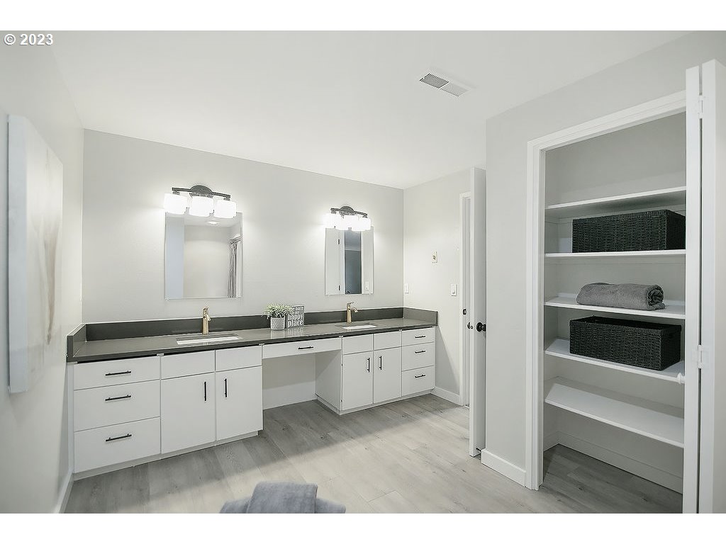 2811 Northeast 164th Street Ridgefield, WA 98642 - Photo 25 of 43 a large white kitchen with a sink and dishwasher