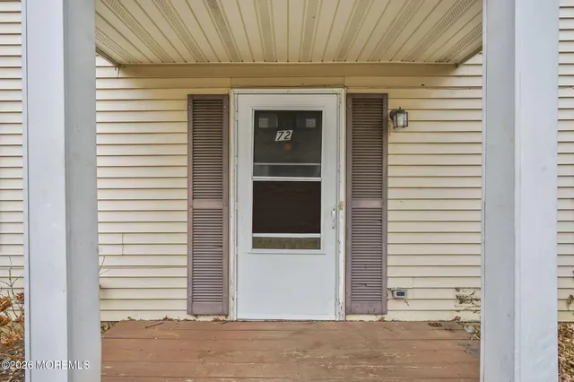 a view of a house with a door and balcony