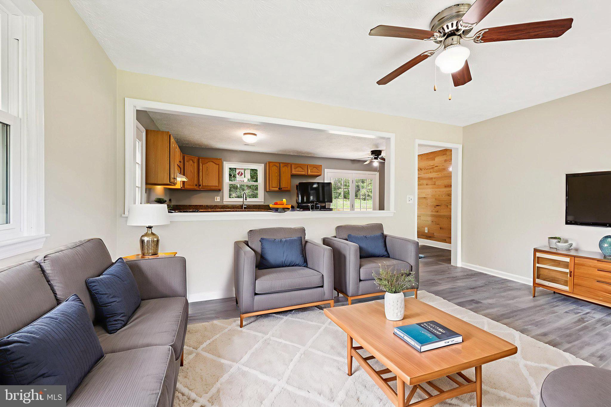 8159 Settle School Road Rixeyville, VA 22737 - Photo 12 of 16 a living room with furniture and a flat screen tv