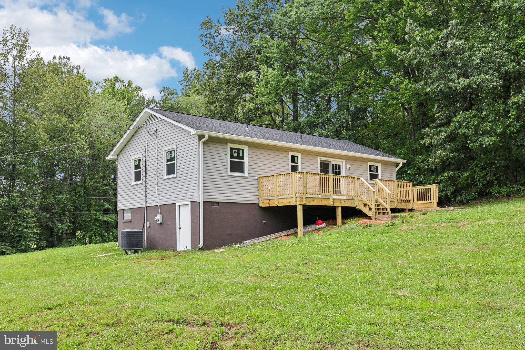 8159 Settle School Road Rixeyville, VA 22737 - Photo 3 of 16 a view of a house with a backyard and sitting area