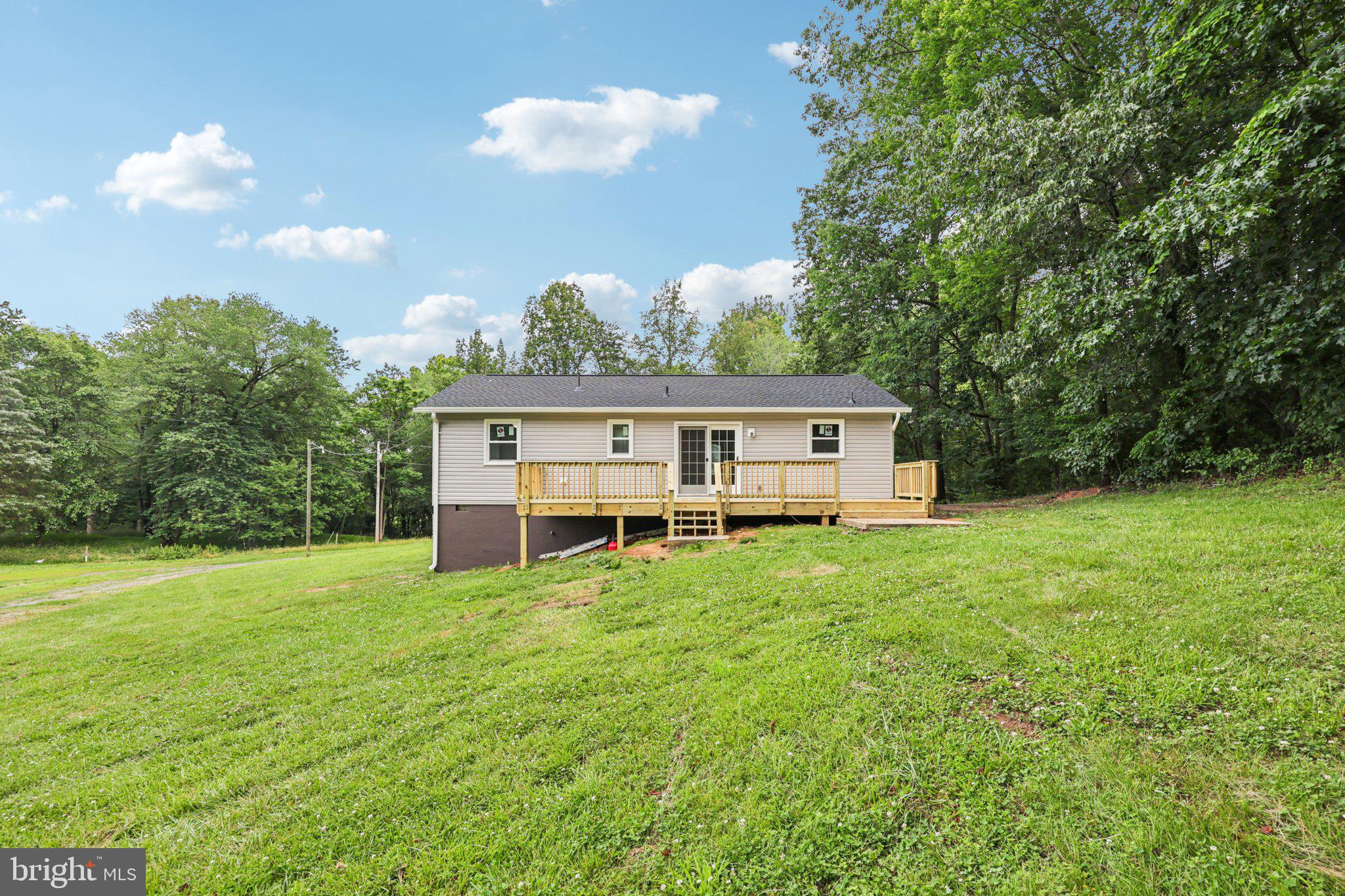 8159 Settle School Road Rixeyville, VA 22737 - Photo 5 of 16 a view of a house with a backyard