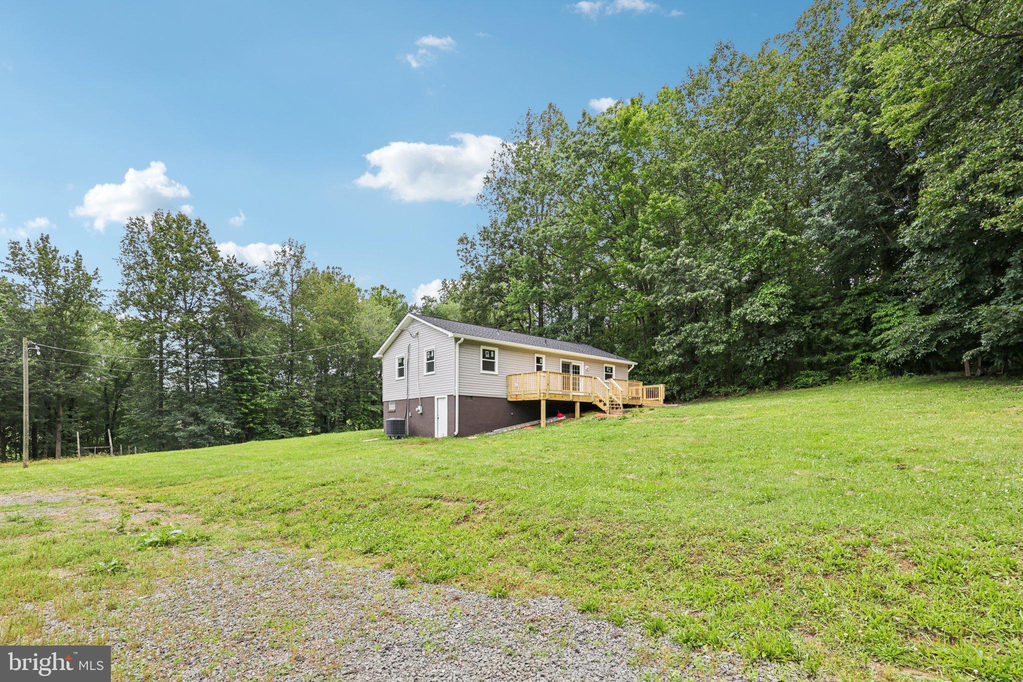 8159 Settle School Road Rixeyville, VA 22737 - Photo 9 of 16 a view of a house with a yard and basketball court