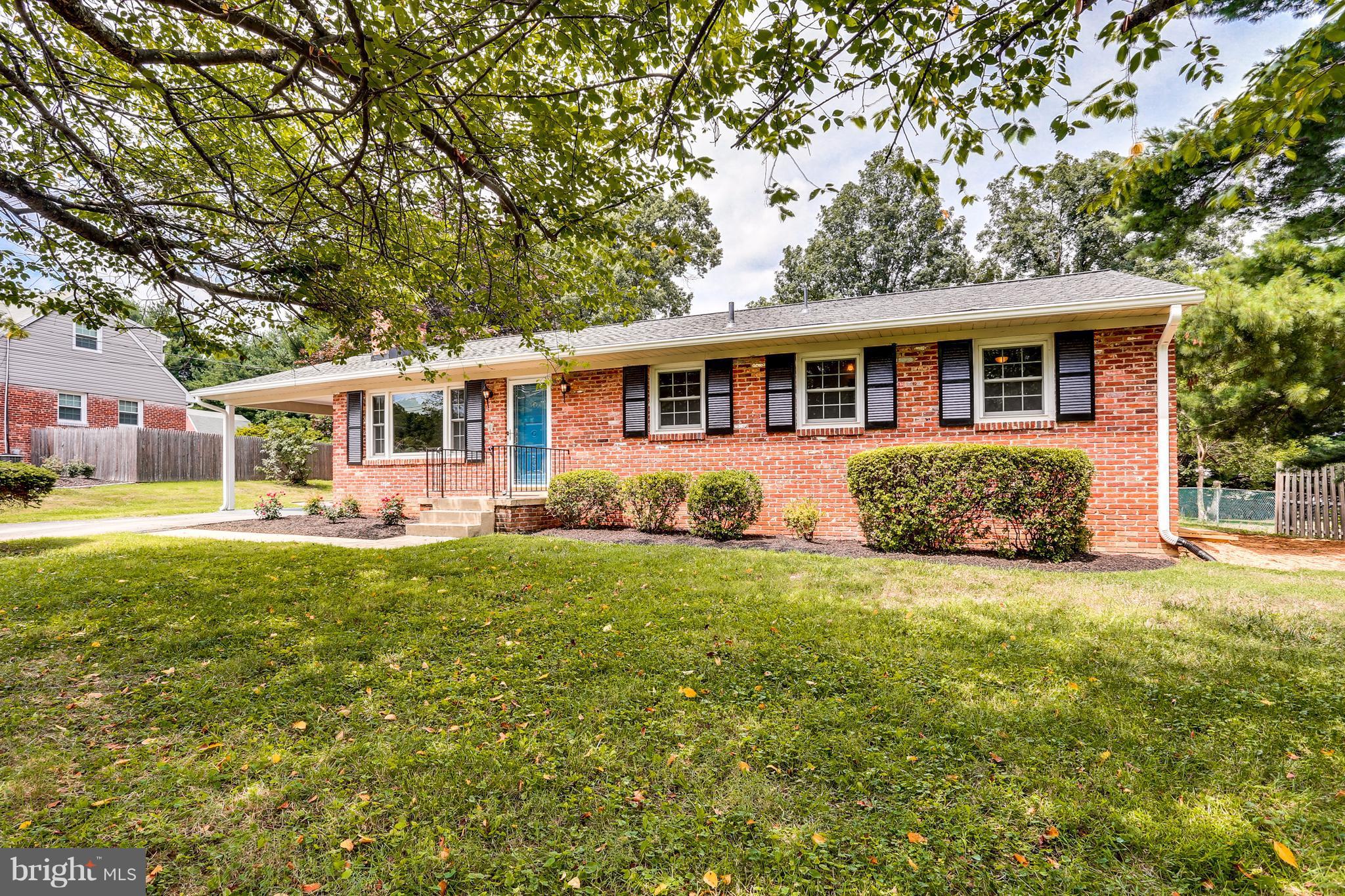 15407 Rowland Lane Silver Spring, MD 20905 - Photo 2 of 29 a front view of a house with a garden