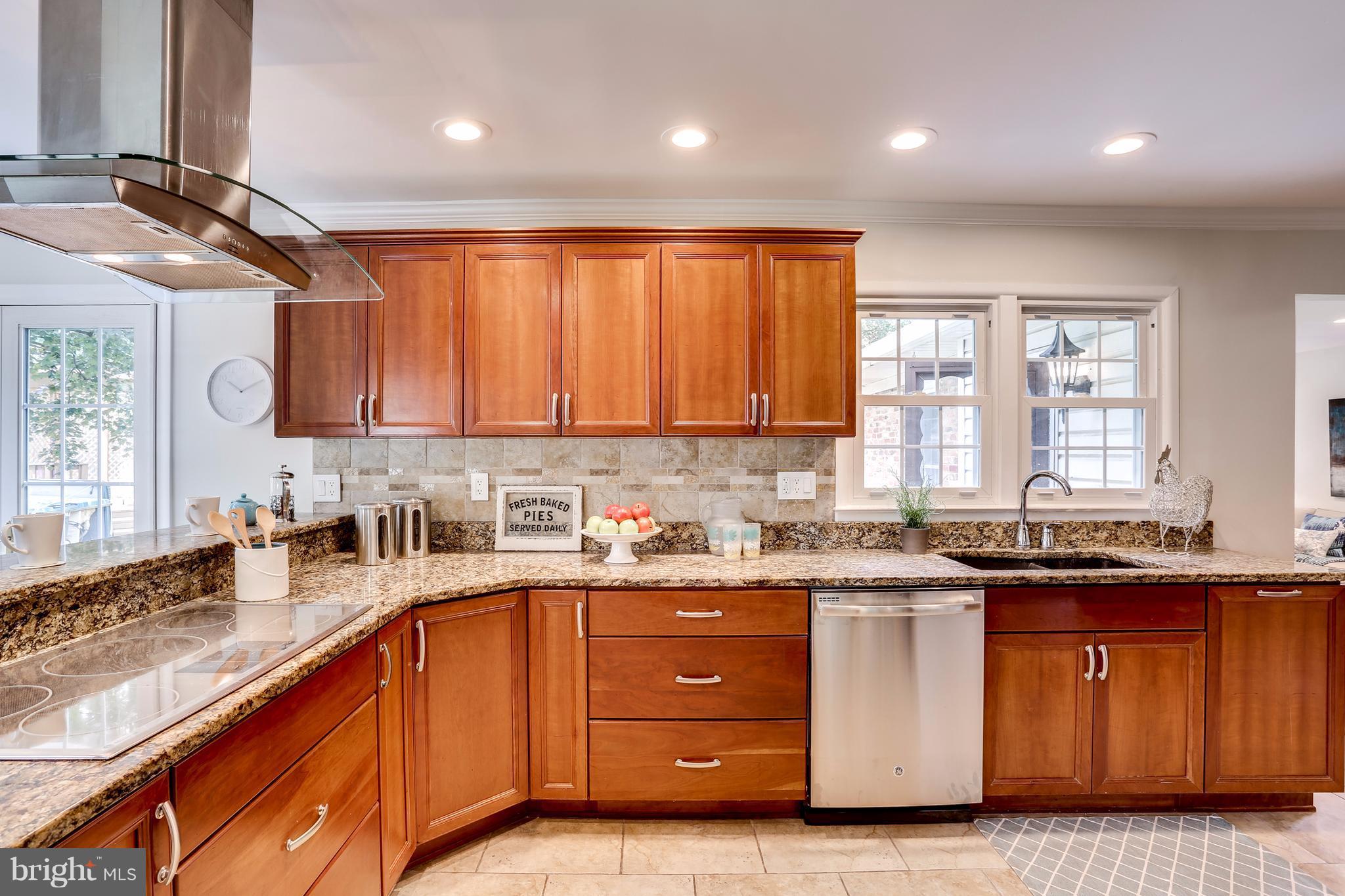 15407 Rowland Lane Silver Spring, MD 20905 - Photo 11 of 29 a kitchen with a sink stove and cabinets