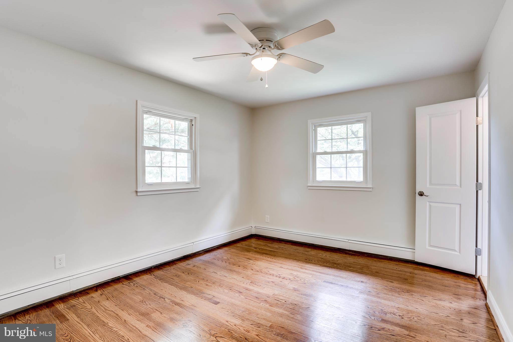 15407 Rowland Lane Silver Spring, MD 20905 - Photo 22 of 29 wooden floor in an empty room with a window