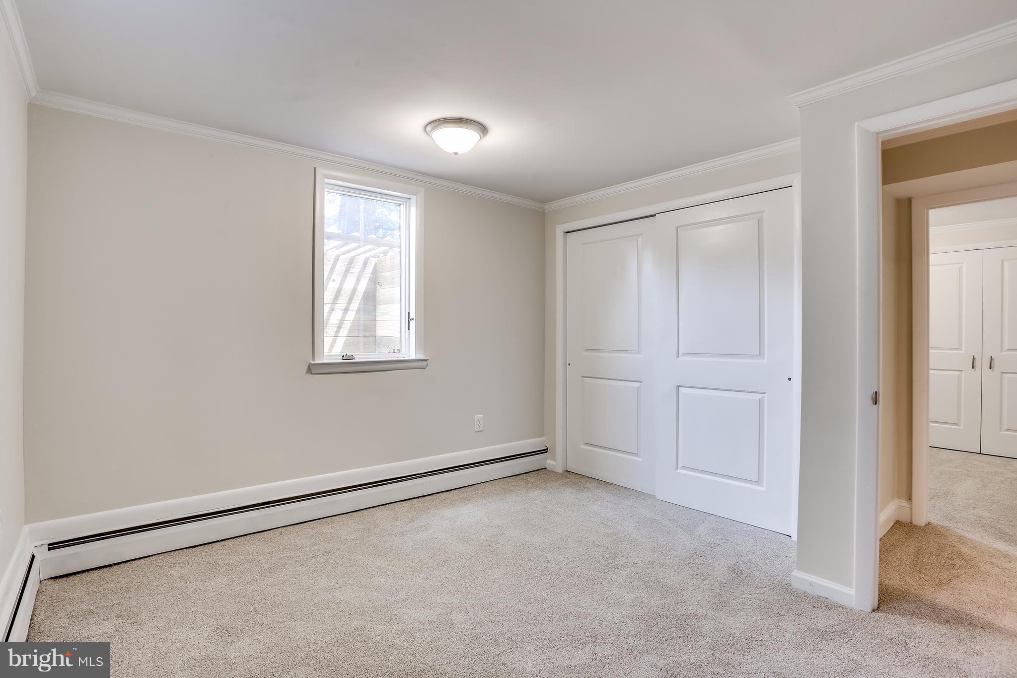 15407 Rowland Lane Silver Spring, MD 20905 - Photo 24 of 29 an empty room with windows and closet