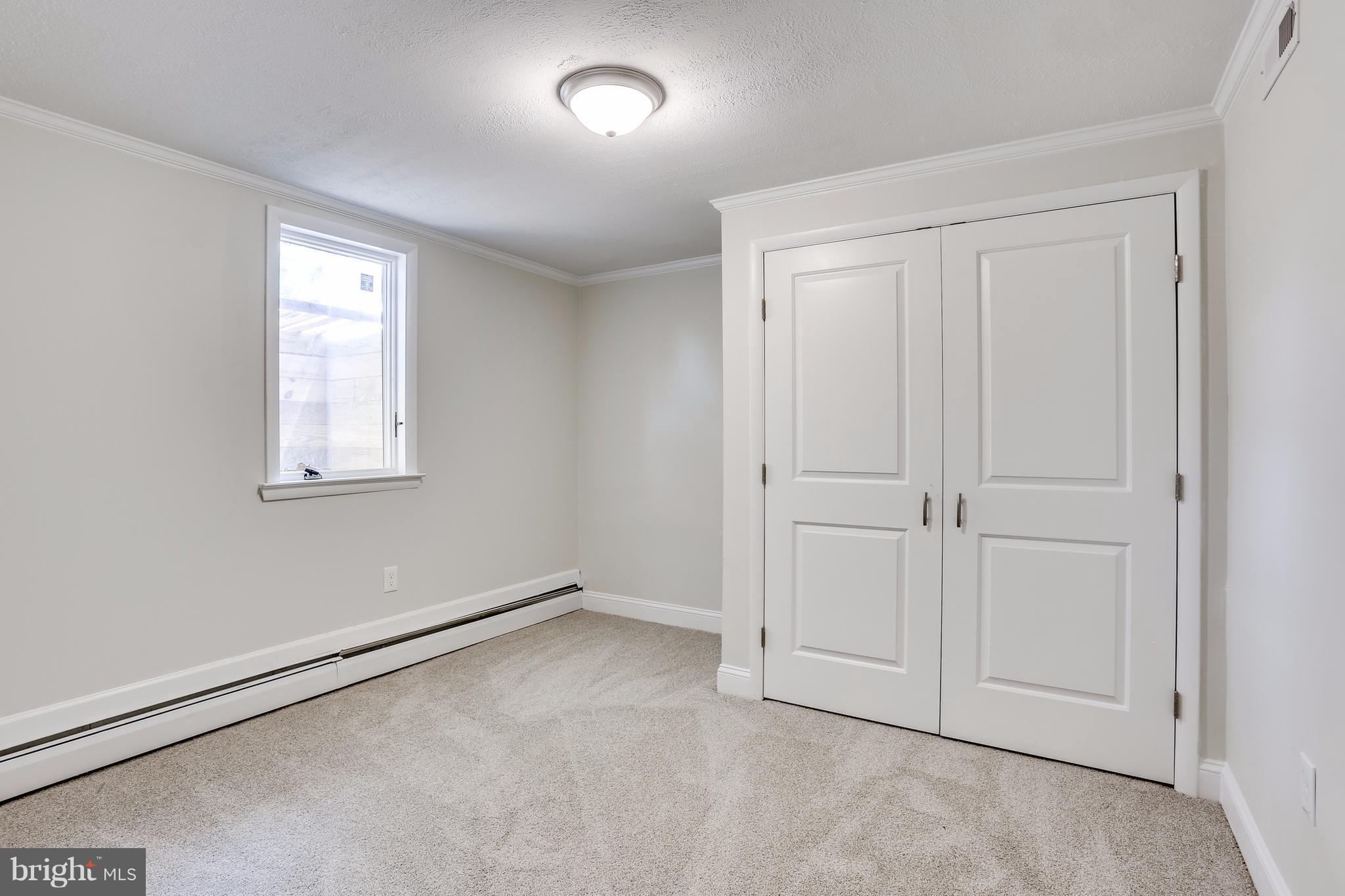 15407 Rowland Lane Silver Spring, MD 20905 - Photo 25 of 29 an empty room with windows