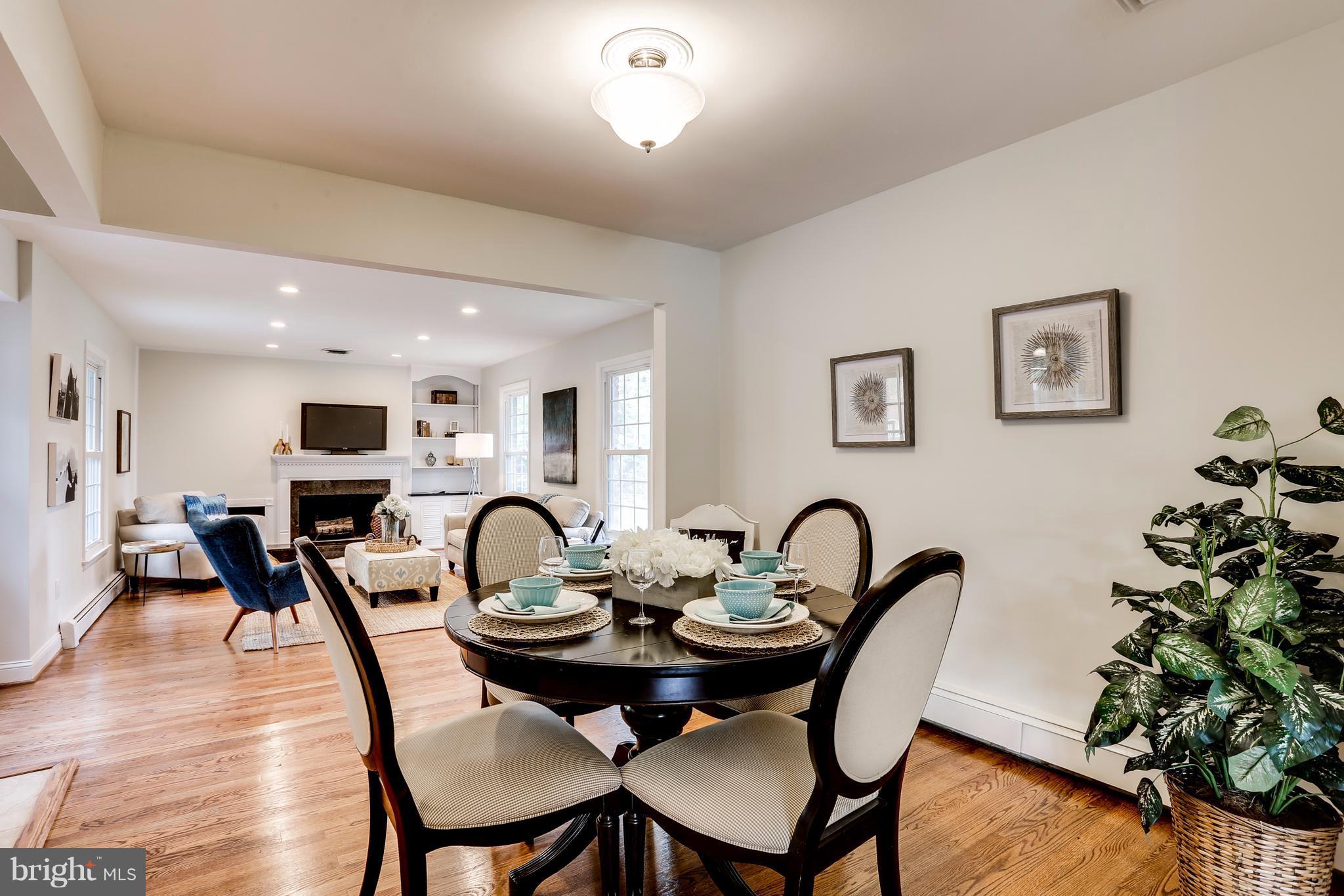 15407 Rowland Lane Silver Spring, MD 20905 - Photo 6 of 29 a dining room with furniture and wooden floor