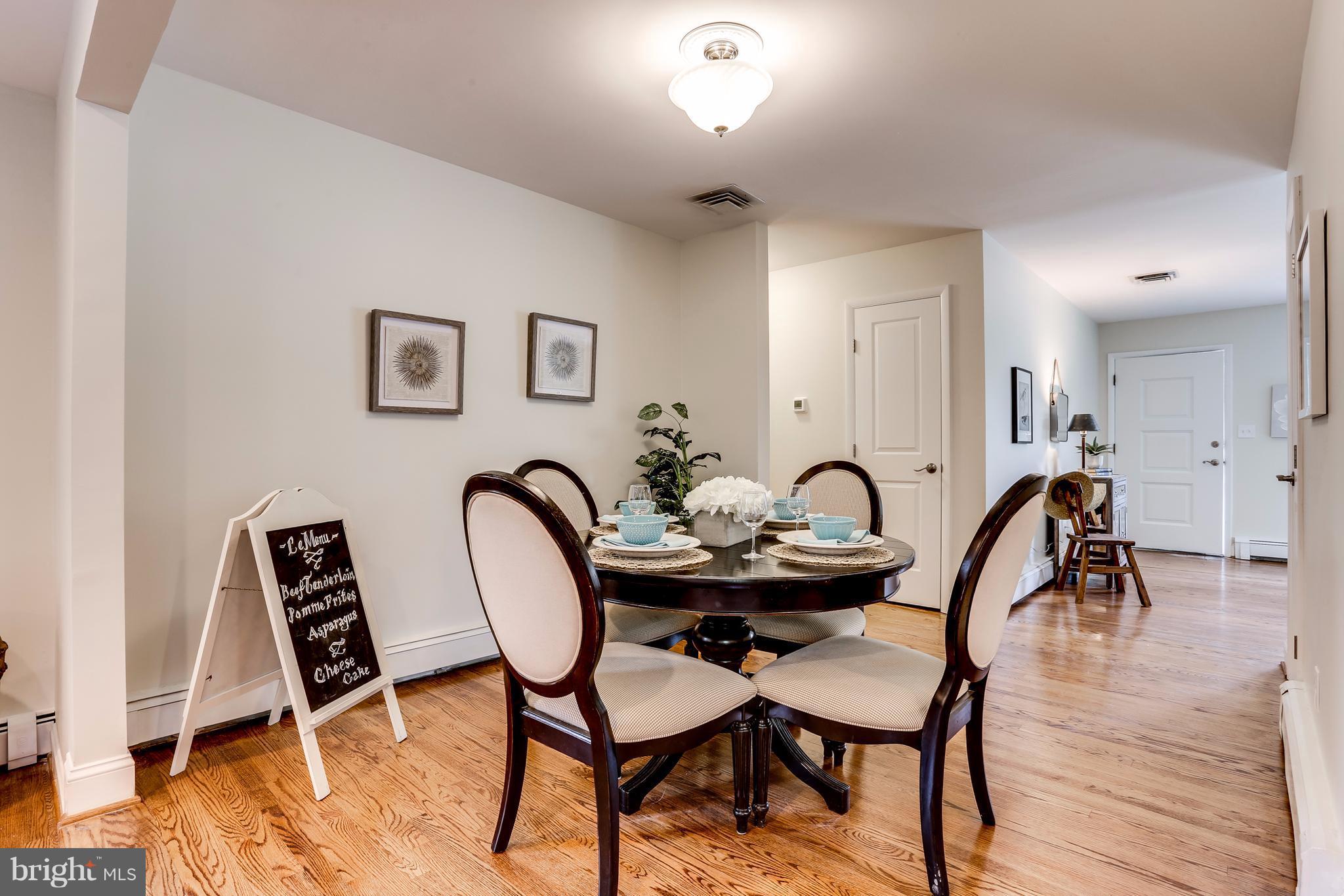 15407 Rowland Lane Silver Spring, MD 20905 - Photo 7 of 29 a view of a a dining room with furniture and wooden floor