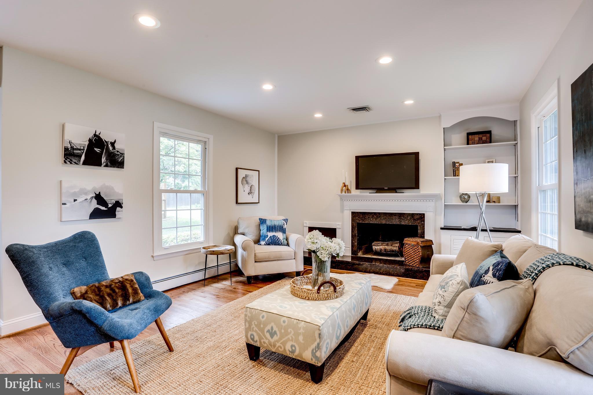 15407 Rowland Lane Silver Spring, MD 20905 - Photo 10 of 29 a living room with furniture fireplace and a window