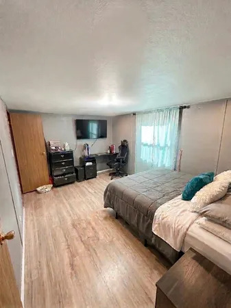 a bedroom with a bed and a view of bedroom
