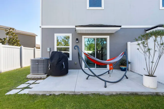 a spacious bedroom with a bed and a window