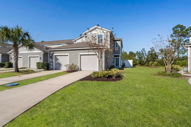 an aerial view of a house with a garden